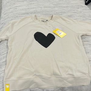 New, with tags Kerri Rosenthal sweatshirt. Ecru with black heart. Size S